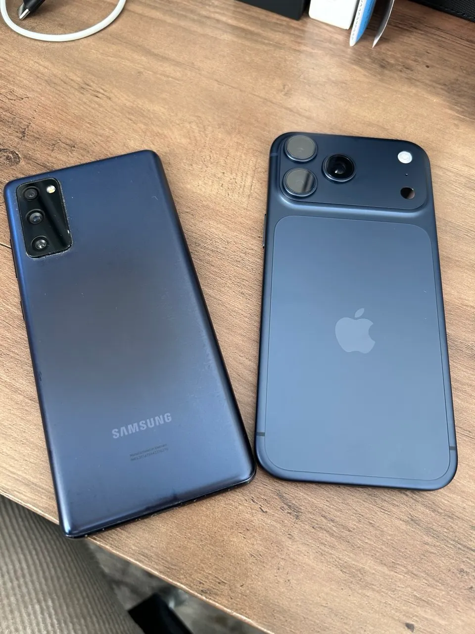 An Android phone and an iPhone, side-by-side on my desk.